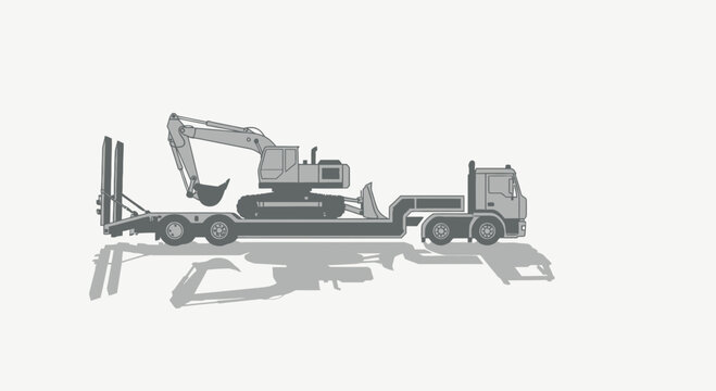 Heavy Machinery Transported Via Truck and Lowboy Trailer