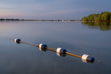 early summer morning in Boyd Lake State Park, Colorado with an empty swimming beach