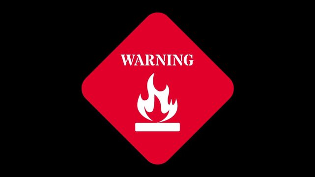 A red diamond shaped sign features the word warning above a flame icon to alert people about the highly flammable nature of stored liquid fuel