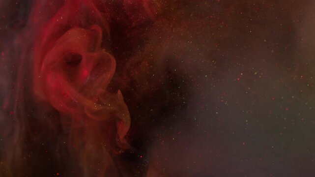 Paint explosion. Glitter fume wave. Defocused orange pink blue color rainbow splash cloud liquid particles spreading on abstract background.