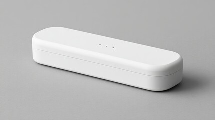 Minimalist communication device with a sleek design and polished surface on a neutral backdrop.