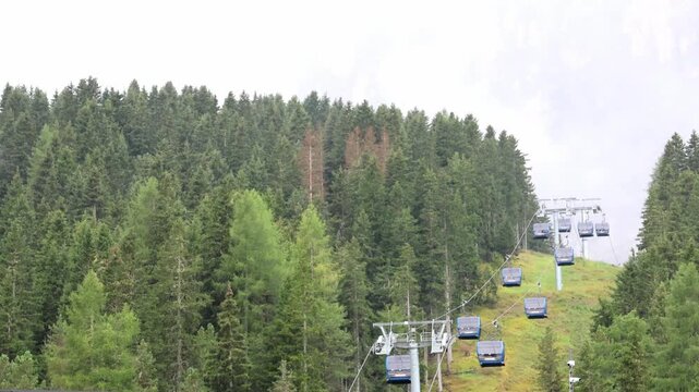 cable cars in the italian alps (dolomites italy) ortisei seceda alpe di siusi val gardena ski lift (view of beautiful mountains in the background) travel tourism destination europe european trip