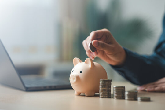 Personal finance and savings concept with piggy bank and coin stacks, representing budget planning, financial goals, monthly savings, and long-term money management for a secure future.