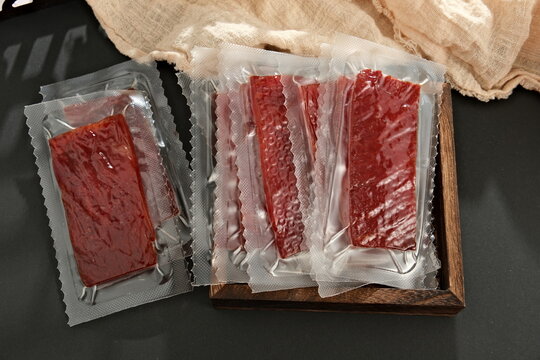 Vacuum packaged pork jerky snacks