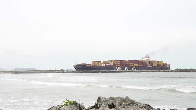 Container ship MSC JULIE sails past Atalaia, Itajai, Brazil