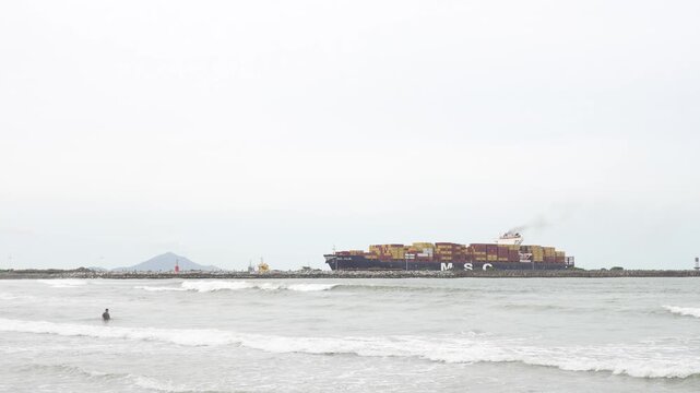 Container ship MSC JULIE sails past Atalaia, Itajai, Brazil