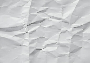 Obraz premium Crumpled white paper texture with deep folds and creases.