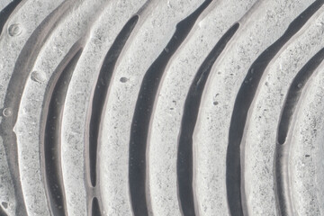 Abstract texture creating pattern of undulating waves with light and shadow