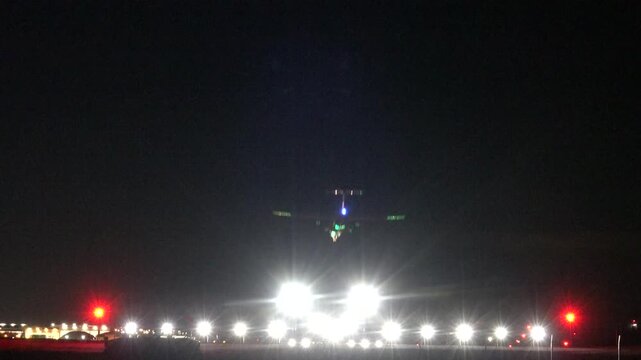 Stockholm, Sweden A commercial airplane lands at night in winter at Arlanda Airport. 