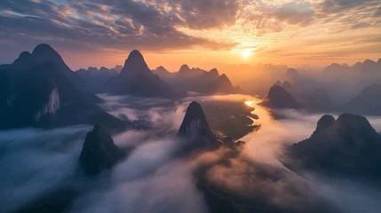 Keuken achterwand Guilin Aerial view of guilin mountains at sunrise with misty valley and low clouds in guangxi, china  © Nazia