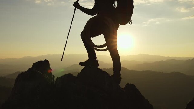 Hikers are enjoying the stunning view on the high mountains.Tourist with backpack on mountain peak.