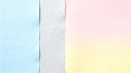 Fototapeta premium Soft pastel gradient paper in blue, grey, and pink hues 