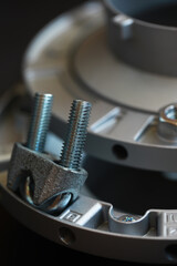 Close-Up of Industrial Metal Components with Bolts and Fasteners in a Technical Setting