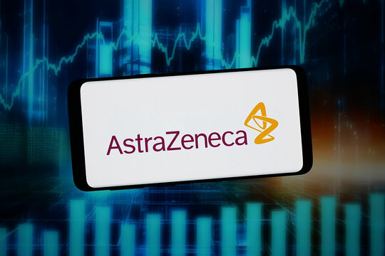 Stuttgart, Germany - 02-11-2026: In this photo illustration, the logo of pharmaceutical company AstraZeneca plc is displayed on a smartphone in front of abstract background on computer screen.