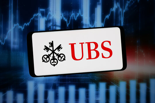 Stuttgart, Germany - 02-11-2026: In this photo illustration, the logo of Swiss financial services company UBS Group AG is displayed on a smartphone in front of abstract background on computer screen.