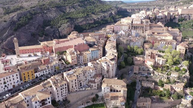 Picturesque view from drone of historic district of Cuenca city on steep spur above deep gorges of Jucar and Huecar rivers on sunny spring day, Spain
