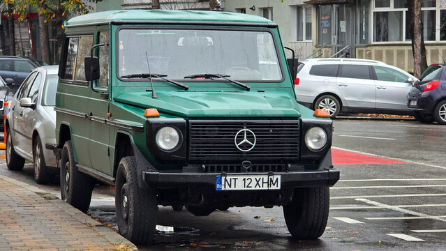 Piatra Neamt, Romania - November 10, 2025: Green Mercedes-Benz G-Class 290 GD parked on the street. 90's car