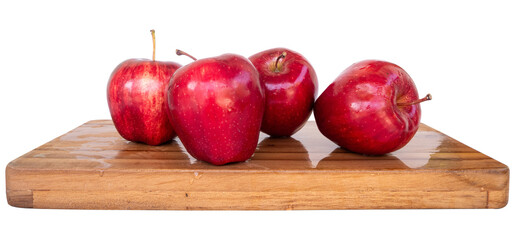 red apples on a cutting board