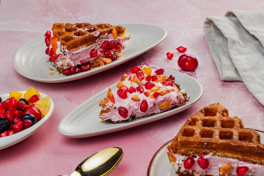 Mix Fruit Waffles are golden, fluffy waffles topped with a colorful assortment of fresh fruits like strawberries, kiwi, blueberries, and bananas. Finished with syrup, whipped cream, or a dusting of po