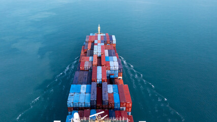 Fototapeta premium Aerial view container ship carrier container on sea, Global business logistics and Global trade transportation by container ship, Container ship freight shipping import export logistics supply chain.