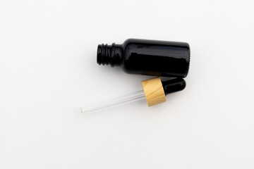Black Serum Bottle Isolated on Clean White Background for Beauty Display