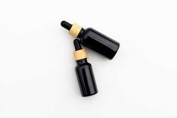 Black Serum Bottle Isolated on Clean White Background for Beauty Display