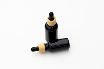 Black Serum Bottle Isolated on Clean White Background for Beauty Display