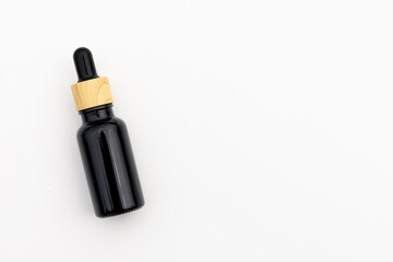 Black Serum Bottle Isolated on Clean White Background for Beauty Display