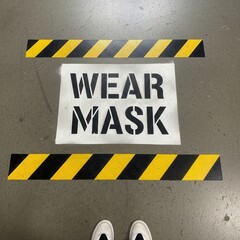 Industrial Floor Signage Displaying Mandatory Mask Requirement With Yellow Hazard Stripes and