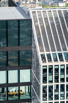 Corporate office architecture in Frankfurt Germany with modern glass facade grid in the city showing clean lines geometry and financial district character