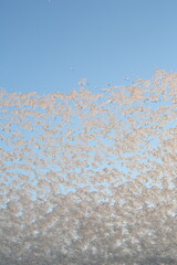 snow on the dormer window with the sun shining on it