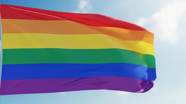 Waving Rainbow Flag Under a Cloudy Sky