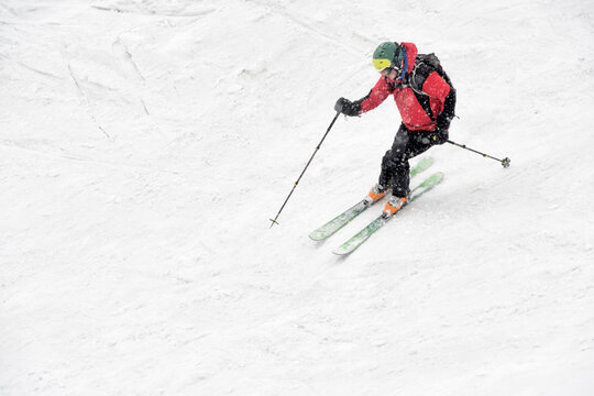 Georgia, Caucasus, Gudauri, man on a ski tour riding downhill