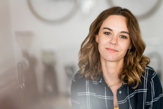 Portrait of a young business owner in her own coffee shop