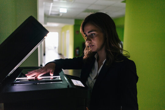 Businesswoman making a copy of her hand