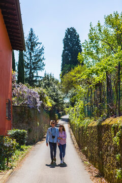 Affectionate couple strolling through narrow alleys in Florence, Tuscany, Italy