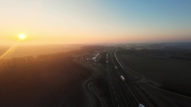 Morning Traffic Panorama. Dawn Views Of Moving Transport. Sunrise Captures Busy Roads And Train Routes. Early Morning Aerial Shot Showcasing Bustling Transportation Routes And Vehicles
