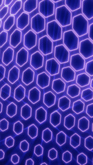 Obraz premium Futuristic neon hexagon grid with glowing purple outlines on blue background, representing digital networks, technology patterns, and cyber connectivity