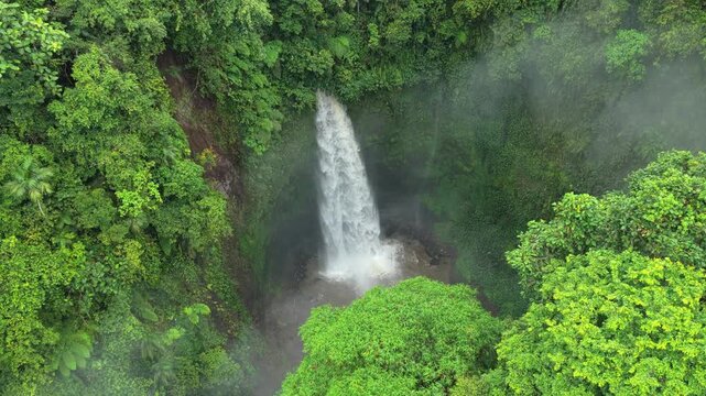 Nungnung waterfall aerial view in bali jungle