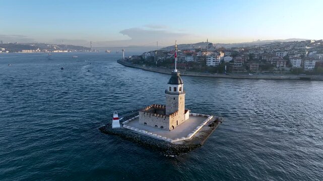 Maiden's Tower. 4k aerial orbit drone view at sunrise in Bosphorus Strait. Shot of the Kiz Kulesi in istanbul, Turkey, situated in the sea at sunset popular tourist destination in the world.