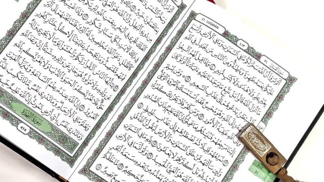 Sacred Pages of the Quran: An intimate view of the pages of the Quran, revealing intricate calligraphy and symbolic text, the book serves as a cornerstone of faith.