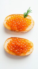 Two red caviar sandwiches with rosemary. Vertical top view of gourmet seafood appetizer on white