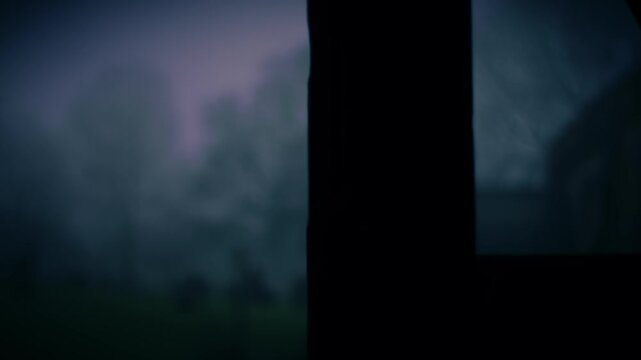 Lonely Graveyard on foggy day though view of church lych gate