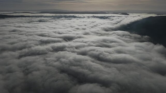 Thermal inversion with rolling clouds on the mountains in Portugal