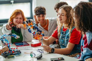 Fototapeta premium Diverse group of students working on engineering school project.