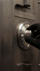 Gloved hand turning metal safe dial engraved with quantum security encryption keys symbolizing advanced secure access and guarded protection