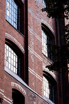 Shadow detail on curve brick facade architecture with windows in Speicherstadt Hamburg Germany showing strong urban lines in daylight
