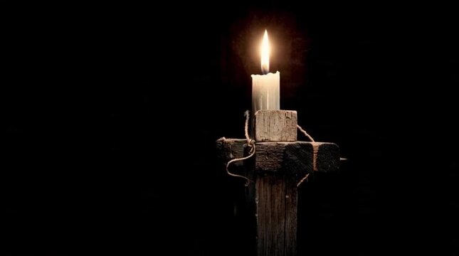 Candle Flame on Wooden Cross in Darkness Religious Background