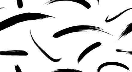Abstract black brush strokes on a white background, showcasing various textures and shapes, ideal for graphic design elements.