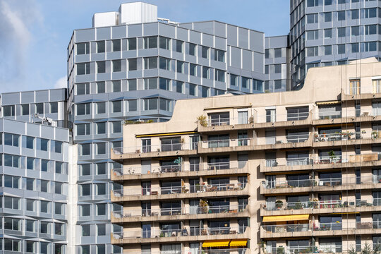 Residential architecture in Paris France showing modern apartment highrise with balcony facade details in a dense urban cityscape and wide skyline view